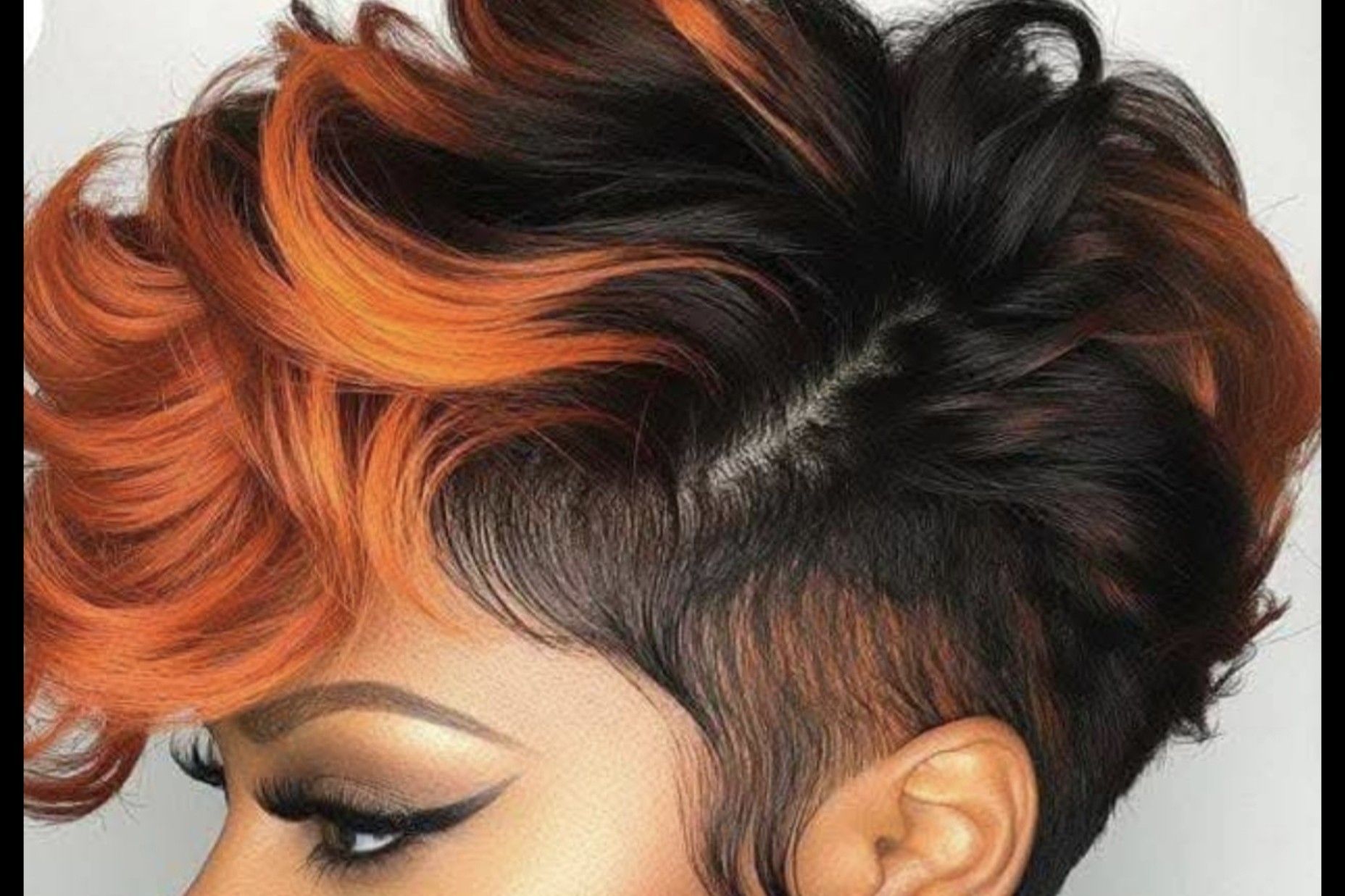  Short pixie cut with vivid copper highlights and black base