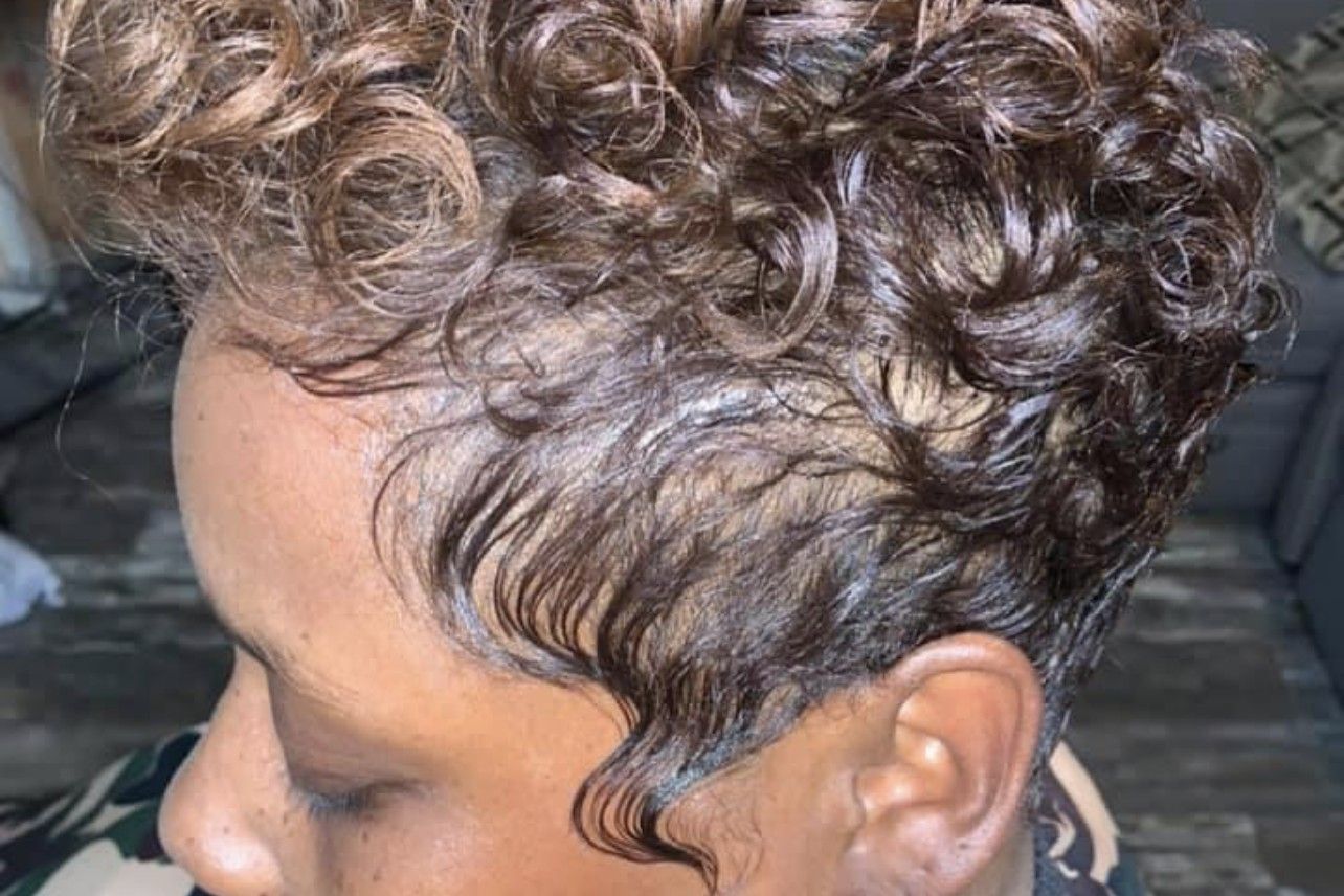 Tapered short cut styled with defined curls