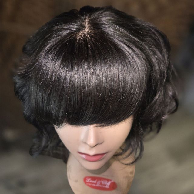 Dark feathered bob unit with a rounded fringe