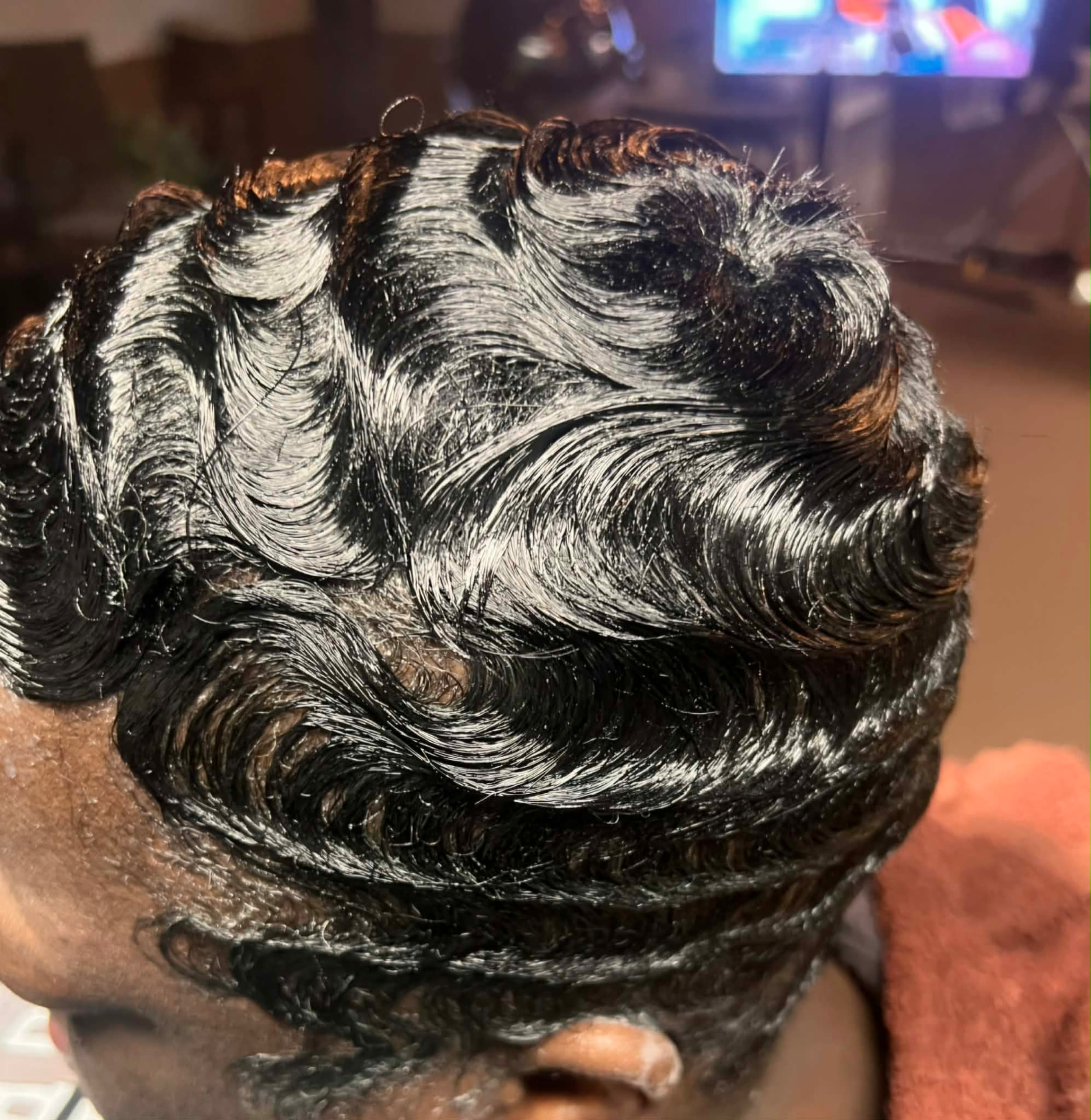 Glossy sculpted finger waves on short natural hair
