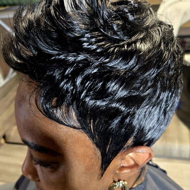 Short sculpted pixie with blonde highlight ribbons