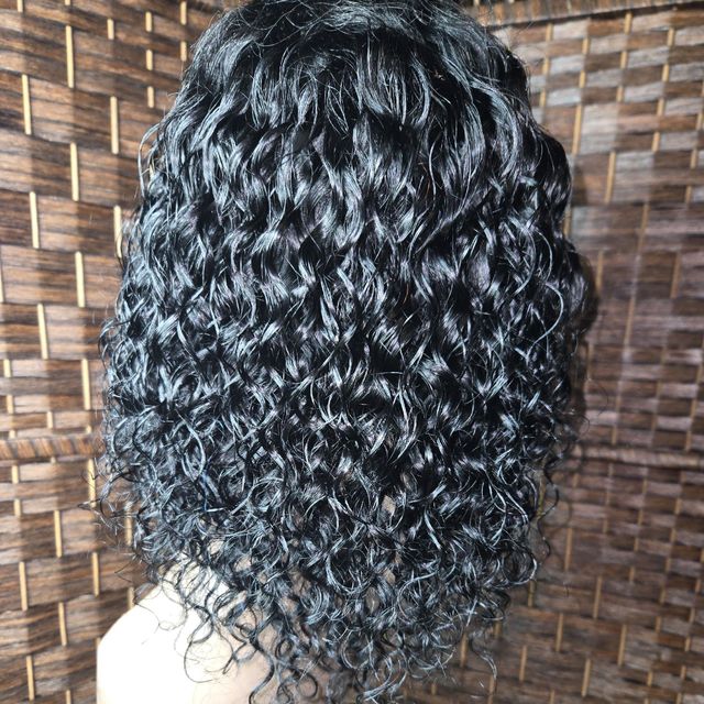 Back view of long defined black spiral curls