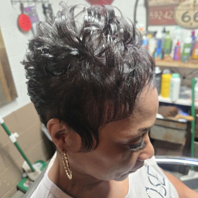 Short tapered cut with curled and textured top