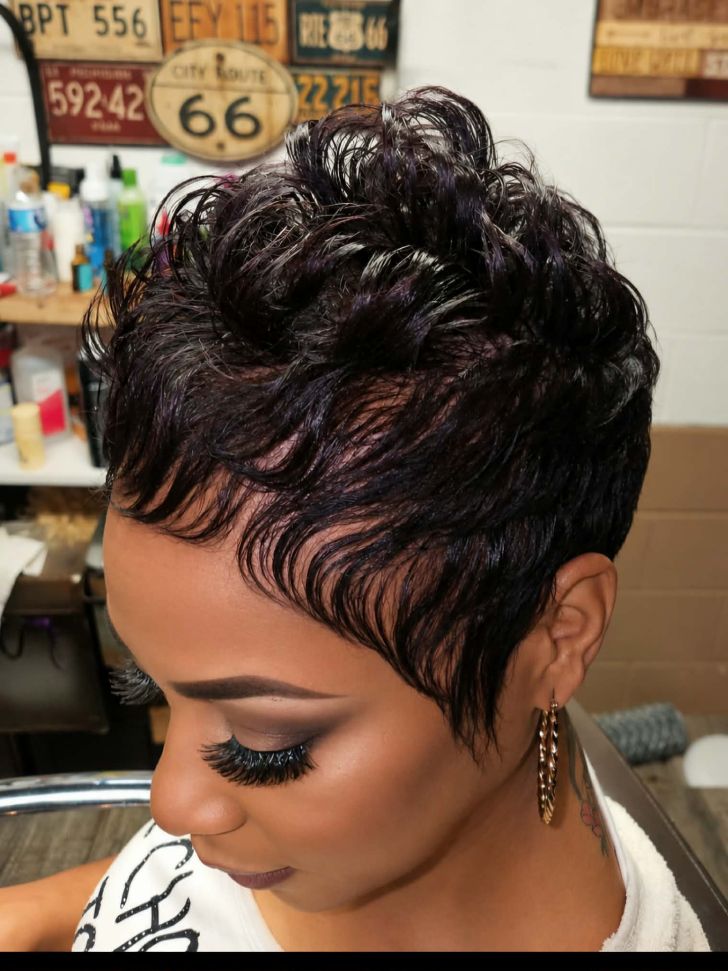 Short dark plum pixie with sculpted waves styled by Jonathan at Hair Tamer Salon