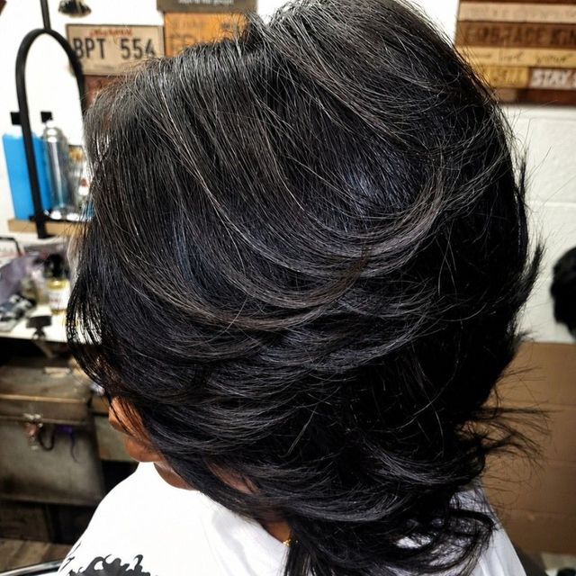 Glossy layered bob with feathered layers
