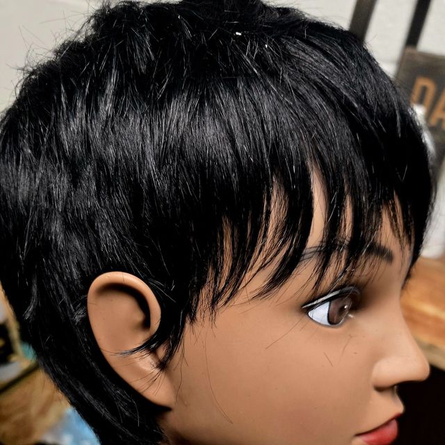 Short textured black pixie unit with wispy bangs