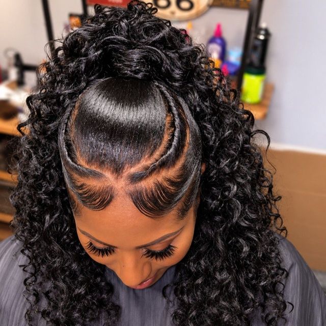 Curly half-up ponytail with braided detail and laid edges