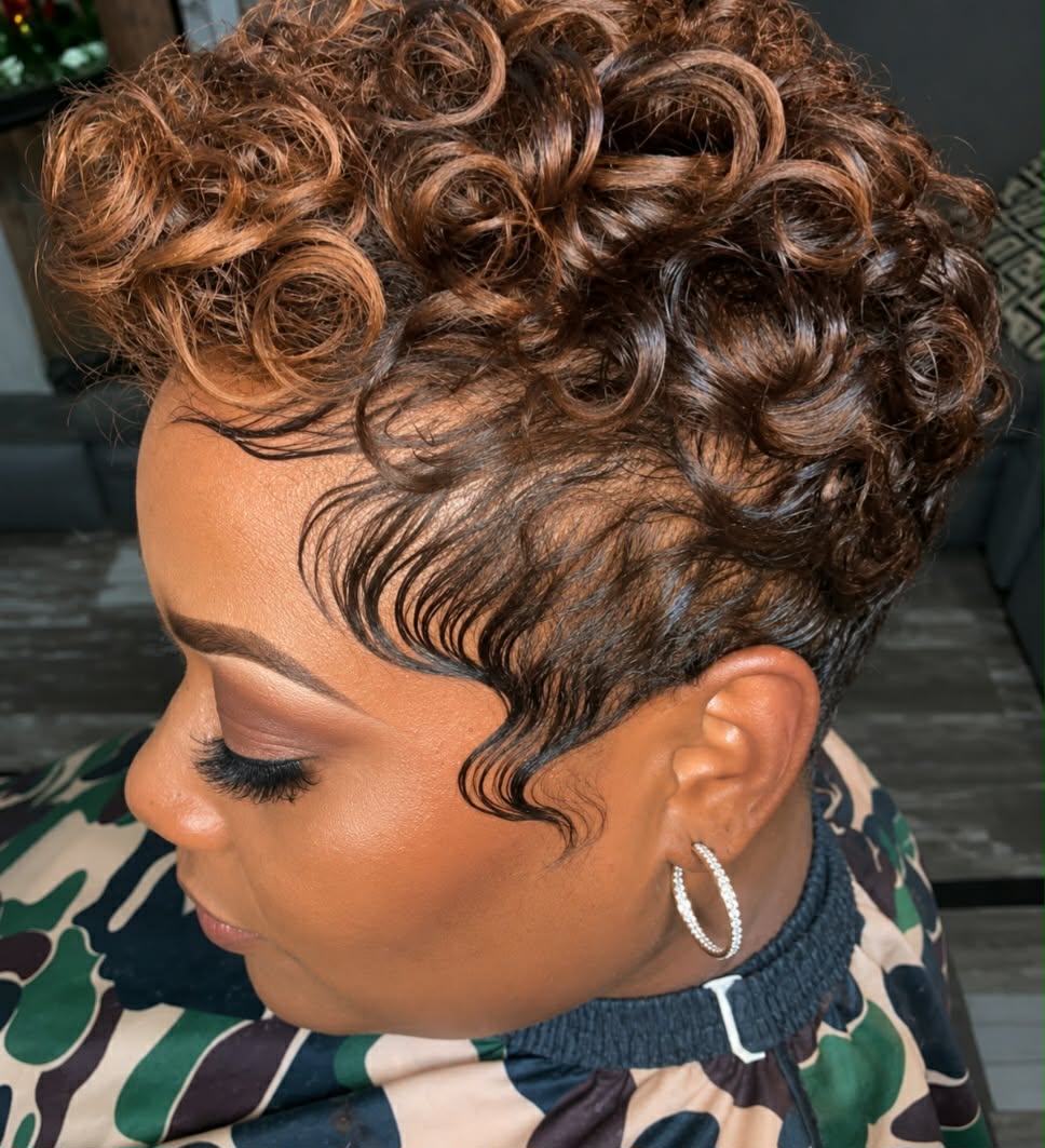 Caramel highlighted curly tapered pixie with laid edges by Jonathan at Hair Tamer Salon
