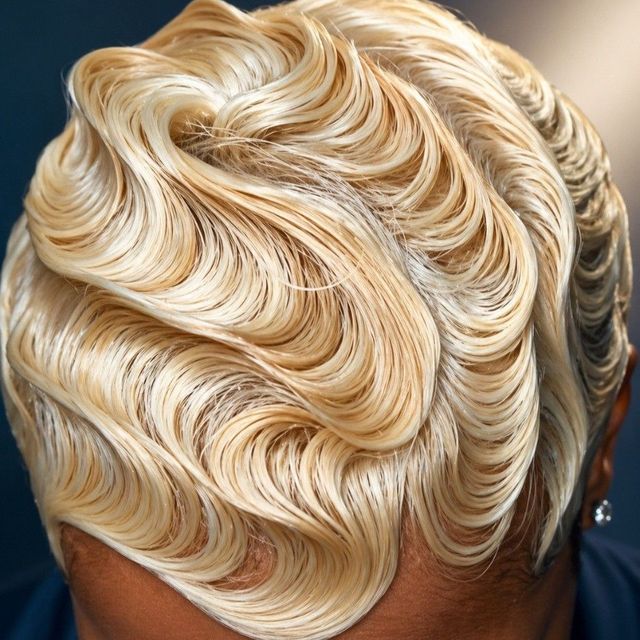 Platinum blonde short hair in a polished wave set