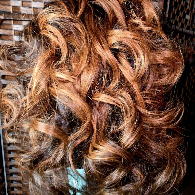 Long copper and honey-blonde spiral curls