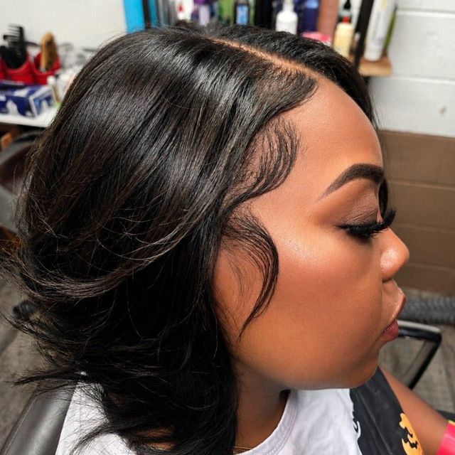 Sleek side-parted blowout with laid edges